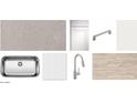 Kitchen finishes showcasing quartz countertops, white cabinets, stainless steel sink, and wood floors at 47705 W Kenner Dr, Maricopa, AZ 85139