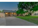 Inviting single-story home featuring manicured lawn, mature shade tree and long private driveway at 803 W 18Th St, Tempe, AZ 85281