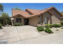 Beautiful single-story home with desert landscaping, a two car garage, and welcoming curb appeal at 9280 E Davenport Dr, Scottsdale, AZ 85260