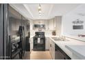 Well-lit kitchen boasts modern appliances, ample counter space, and sleek cabinetry at , Mesa, AZ 85201