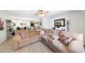 Open-concept living area with a large sectional sofa, modern lighting, and neutral decor at , Mesa, AZ 85201
