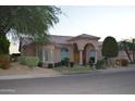 Stunning single-story home with an arched entry, well-manicured landscaping, and a tile roof at 11290 N 117Th St, Scottsdale, AZ 85259