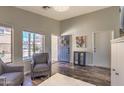 Comfortable living room boasts natural light from windows and a welcoming blue front door at 1212 S Boulder St # C, Gilbert, AZ 85296