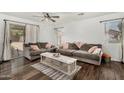Bright living room with plush sofas, stylish coffee table, and modern decor at 16160 W Custer Ln, Surprise, AZ 85379