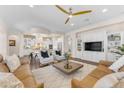 Open-concept living room featuring a seamless connection to the kitchen and dining areas at 1771 E Alegria Rd, Queen Creek, AZ 85140