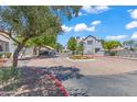Exterior view of a well-maintained community with lush landscaping and ample parking at 1800 W Elliot Rd # 240, Chandler, AZ 85224