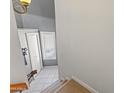 Bright staircase leading to the main floor with tile landing, and a window at 1800 W Elliot Rd # 240, Chandler, AZ 85224