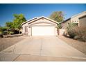 Well-maintained home with a two-car garage and desert landscaping for easy upkeep at 2533 N 114Th Ave, Avondale, AZ 85392