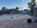 Backyard showcasing an empty pool with potential for relaxation and outdoor enjoyment at 3639 W Beryl Ave, Phoenix, AZ 85051