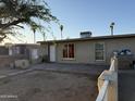 Exterior showcases a single-story home with a small yard, minimal landscaping, and a neutral color palette at 3946 W Holly St, Phoenix, AZ 85009