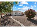 Charming single-story home with low-maintenance desert landscaping and a walkway to the front door at 427 S 80Th Way, Mesa, AZ 85208
