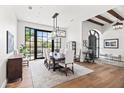 Elegant dining room with a large table, stylish chandelier, and views of the mountain at 5051 E Lafayette Blvd, Phoenix, AZ 85018