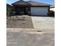 Modern single-Gathering home with a two-car garage and minimal landscaping for a clean, contemporary look at 6050 E Artemis Dr, Florence, AZ 85132