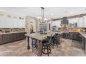 Spacious kitchen with an island, stainless steel appliances, and custom cabinetry at 824 W Whitten St, Chandler, AZ 85225