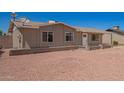 Inviting one-story home with a clean facade and easy-care landscaping at 8818 W Pinchot Ave, Phoenix, AZ 85037