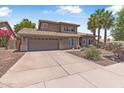 Beautiful home featuring a spacious driveway, well-kept landscaping, and an attached garage at 14609 S 24Th Way, Phoenix, AZ 85048