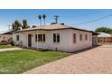 Charming home featuring a well-kept lawn, bright exterior, and inviting outdoor space at 162 N Hunt W Dr, Mesa, AZ 85203
