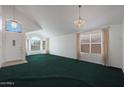 Bright living room features vaulted ceilings and large windows at 19007 N 79Th Dr, Glendale, AZ 85308