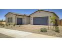 Lovely single-story home featuring a brick driveway, two car garage, and well-maintained desert landscaping at 25162 N 177Th Dr, Surprise, AZ 85387