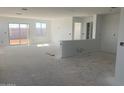Spacious open-concept living area with abundant natural light and a seamless transition to outdoor spaces at 32002 N Pony Express Rd, San Tan Valley, AZ 85143