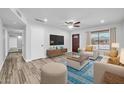 Inviting living room with hardwood floors, recessed lighting, and ample seating at 3444 E Paradise Dr, Phoenix, AZ 85028