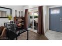 Bright entryway featuring a workspace with modern decor and natural light from sliding glass doors at 3551 N 12Th St # 101, Phoenix, AZ 85014