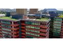 Aerial shot of a building with a rooftop deck and community space, offering beautiful city views at 4808 N 24Th St # 923, Phoenix, AZ 85016
