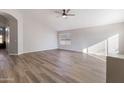 Open concept living room featuring wood-look floors and vaulted ceilings at 635 S Lanus Dr, Gilbert, AZ 85296