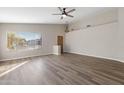Inviting living room with vaulted ceilings, wood-look floors and a large window at 635 S Lanus Dr, Gilbert, AZ 85296
