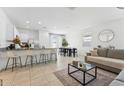 Bright and airy living space featuring tile flooring, neutral paint, and modern furniture at 12672 W Marguerite Ave, Avondale, AZ 85323