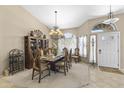 Elegant dining room with a large table set for a meal and a decorative chandelier at 1449 W Sherri Dr, Gilbert, AZ 85233