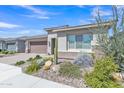 Attractive single-story home with desert landscaping, stone accents, and a two car garage at 22218 N 28Th St, Phoenix, AZ 85050