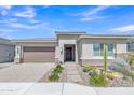 Beautiful single-story home with desert landscaping featuring cacti, stone accents, and neutral colors at 22218 N 28Th St, Phoenix, AZ 85050