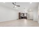 Open-concept living room with tile flooring leading to the kitchen, offering a bright and airy feel at 2250 E Deer Valley Rd # 96, Phoenix, AZ 85024