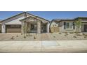 Charming single-story home with well-maintained landscaping and a cozy front porch at 25188 N 174Th Ave, Surprise, AZ 85387