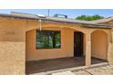 Front porch with decorative columns, tile flooring, and a view of the front yard at 2636 N Dayton St, Phoenix, AZ 85006