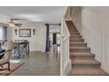 View of the entryway leading to living room and dining area with staircase at 308 E Sheffield Ct, Gilbert, AZ 85296