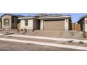 Charming single-story home featuring a two-car garage, desert landscaping, and a welcoming front entrance at 3129 S 155Th Ln, Goodyear, AZ 85338