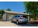 Rear view of a silver car parked in front of an attached garage at 3226 W Grovers Ave, Phoenix, AZ 85053
