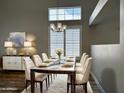 Elegant dining room with stylish lighting fixture and seating for six at 351 N Newport St, Chandler, AZ 85225