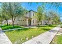 Inviting two-story home with manicured lawn and mature trees at 3514 S Posse Trl, Gilbert, AZ 85297