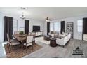 Tastefully decorated living room with dining area featuring virtual staging at 3514 S Posse Trl, Gilbert, AZ 85297