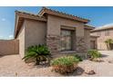 Close-up of desert home highlighting front window and natural rock landscaping at 371 W Indigo Dr, Chandler, AZ 85248