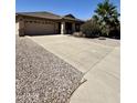 Charming single-story home featuring a spacious driveway and well-maintained landscaping at 3891 E Simpson Rd, Gilbert, AZ 85297