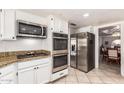 Stainless steel appliances, double oven and granite countertops complete this updated kitchen at 400 W Crofton St, Chandler, AZ 85225