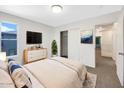 Bright bedroom with a modern dresser, TV, and view of the outside, offering a cozy and inviting space at 4229 E Betsy Ln, Gilbert, AZ 85296