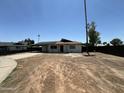 Street view of a newly renovated single-story home with a carport and desert landscaping at 4425 W Sierra St, Glendale, AZ 85304