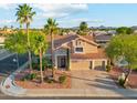 Aerial view of a desert home with a tile roof, mature trees and shrubs, and mountain views at 4563 E Libby St, Phoenix, AZ 85032