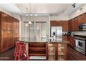 Well-equipped kitchen features ample cabinet space, stainless steel appliances, and a breakfast bar with seating at 6745 N 93Rd Ave # 1129, Glendale, AZ 85305