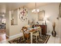 Cozy dining room showcasing a chandelier and wall decor, creating a welcoming atmosphere at 7635 S Taylor Dr, Tempe, AZ 85284